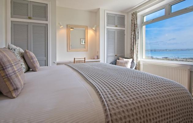 Cottage bedroom with coastal view