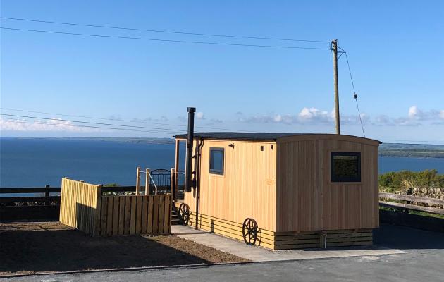Exterior of shepherd hut with view